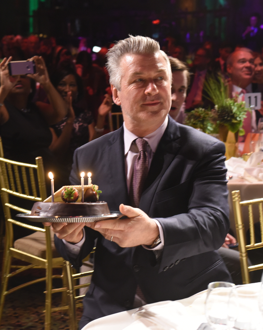 Alec Baldwin presented with a birthday cake while guests sang Happy Birthday